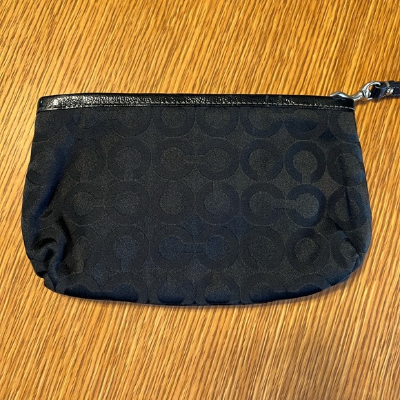 Black Coach clutch with zipper and one inside pocket. - Picture 4 of 9